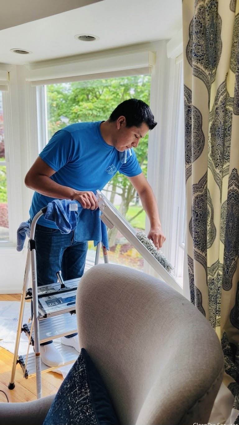 Our staff member cleaning detailed baseboards and corners